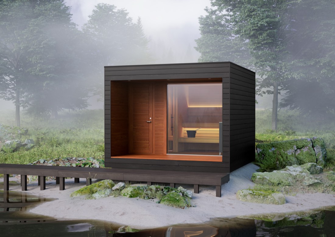 Outdoor sauna cabin glowing warmly by a misty lake
